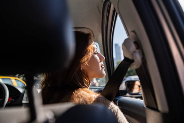 istock Young woman relaxing inside the car 2167815920