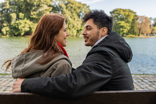 istock Couple talking in a natural park 2167815958
