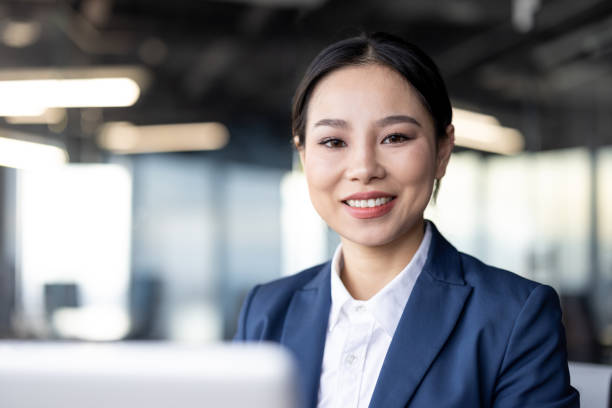 istock Professional businesswoman smiling confidently in modern office setting 2167819024