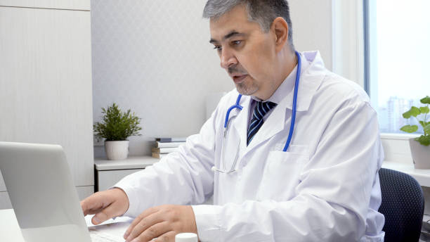 istock Male Doctor Working on Computer in Office 2167820636