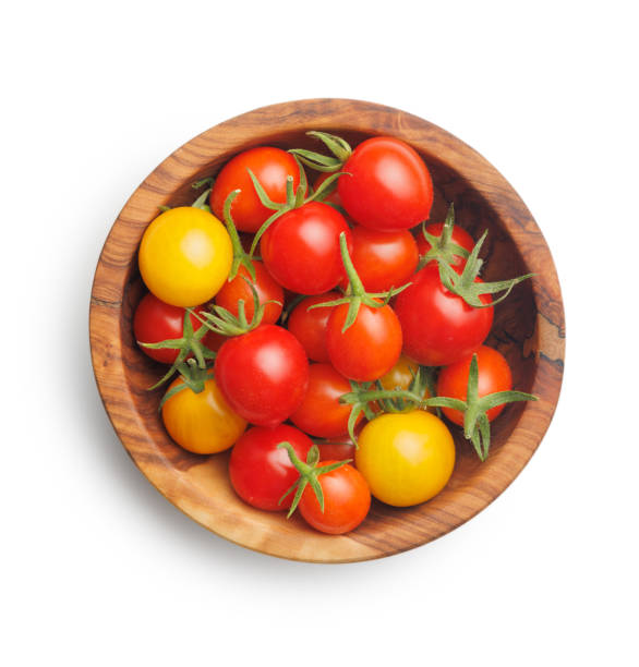istock Different colorful cherry tomatoes in bowl isolated on white background. 2167821941