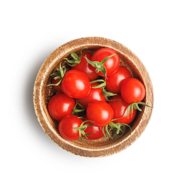 istock Small red cherry tomatoes in bowl isolated on white background. 2167821963