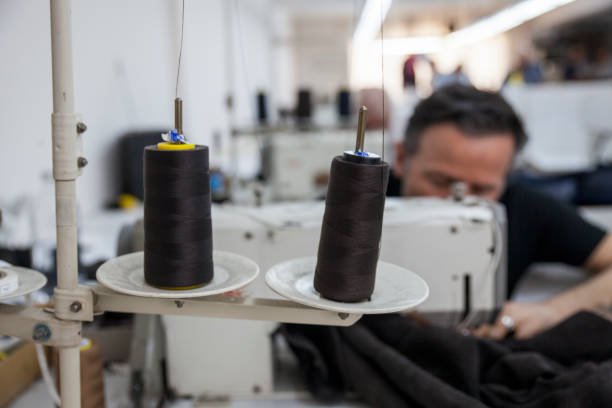 People Working In Leather Clothing Production And Sewing Stages