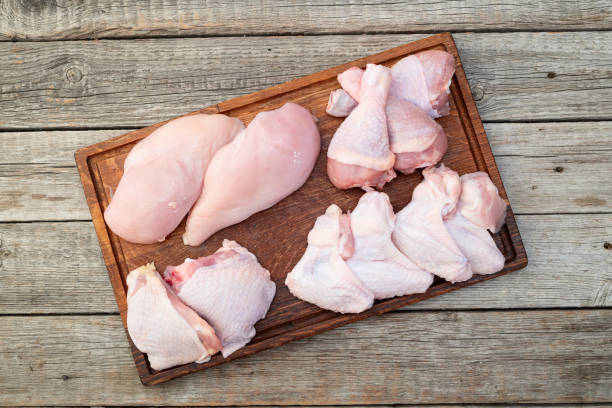 istock Raw mixed chicken meat parts  for cooking on rustic background 2167822604