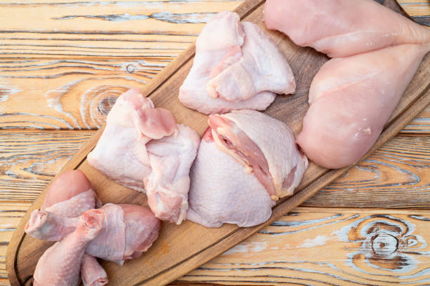 istock Raw mixed chicken meat parts  for cooking on rustic background 2167822617