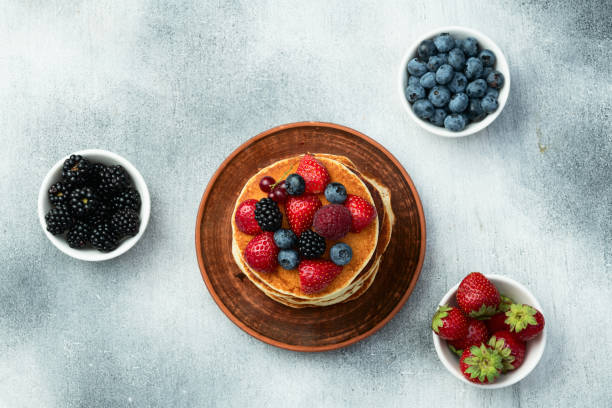 istock Stack of homemade american pancakes with berries . Top view 2167822688