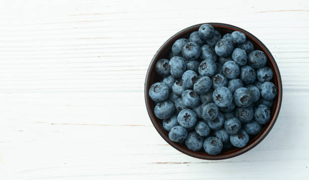istock Blueberry photography in a bowl on rustic background 2167822706