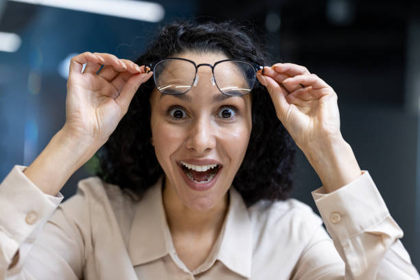 istock Excited woman adjusting glasses in office environment 2167829806