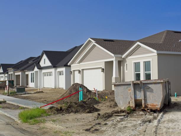 istock Row of zero lot line starter homes in a new home construction site 2167832577
