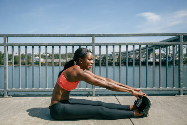 istock Woman stretches her legs before going for a run outside 2167839877