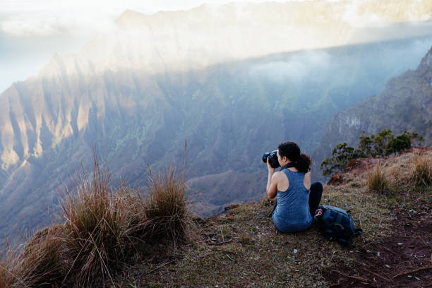 istock Woman takes photos while resting during a hike 2167840089