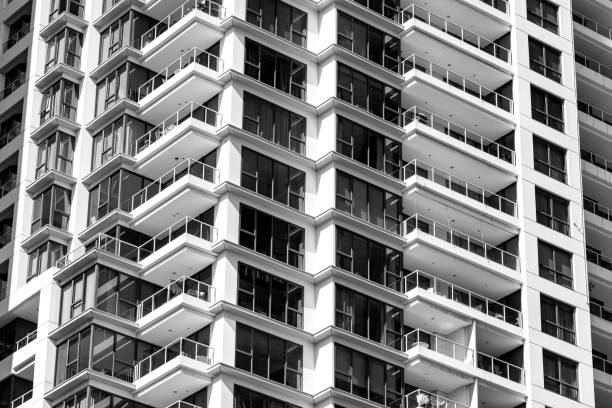 Black and white modern apartment building, background with copy space, full frame horizontal composition