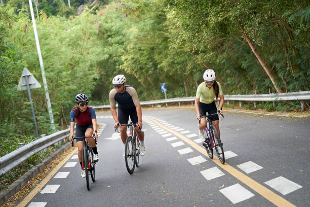 istock young asian people riding bicycle outdoors 2167843342