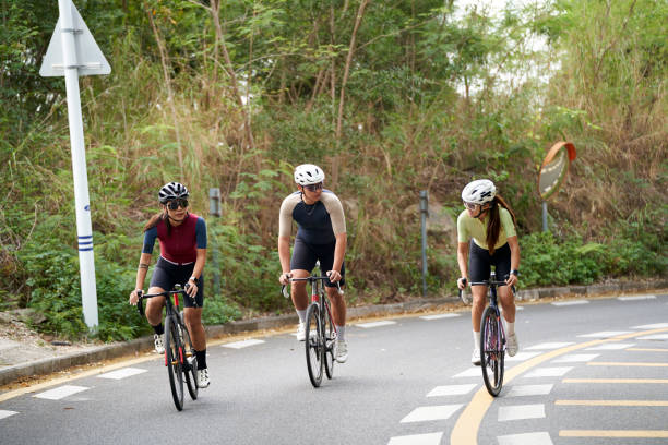 istock young asian people riding bicycle outdoors 2167843344
