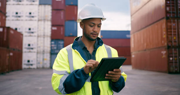 istock Tablet, planning and distribution worker with containers for cargo inventory for international freight logistics. Technology, shipping and male load planner with stock for global supply chain at port 2167844577