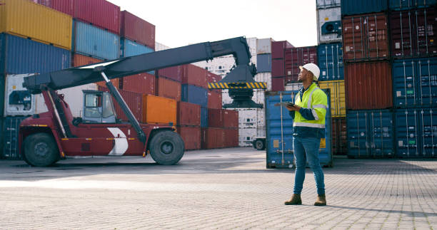 istock Cargo dock, man and tablet for logistics for quality control, stock management or foreman. Engineer, crane and maintenance for freight, supply chain and industry with global shipping company 2167844762