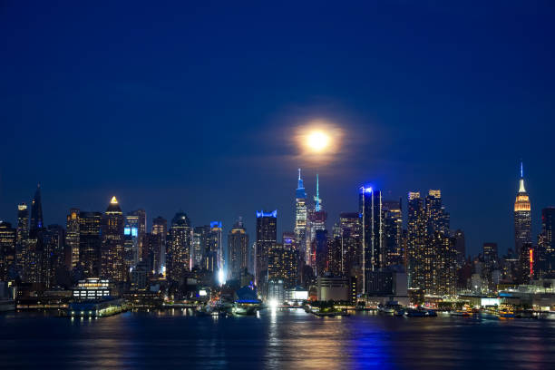 istock Hudson River reflects the lights and New York Skyline at night 2167844875