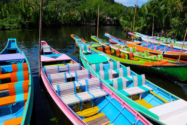 istock Colorful Boats Docked in a Lush Tropical Lagoon 2167845310