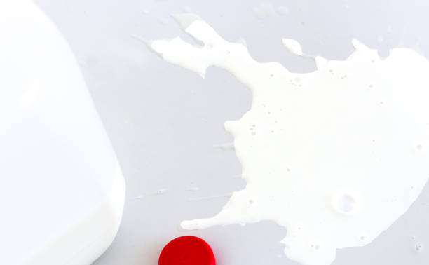 Spilled Milk Next to Milk Carton