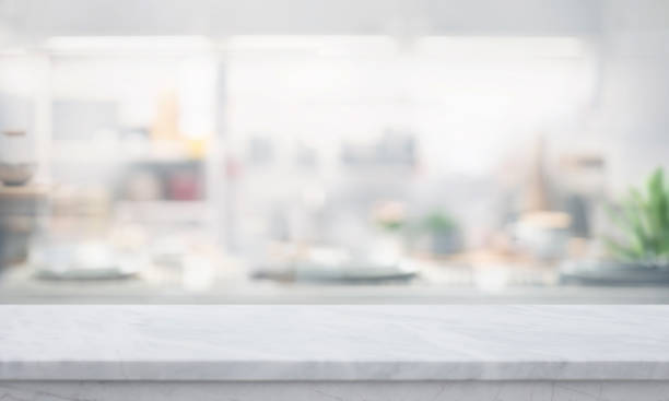 istock A marble countertop with blurred of a bright, modern kitchen.The soft focus on the interior background highlights.making it ideal for showcasing kitchen-related products or display 2167848868