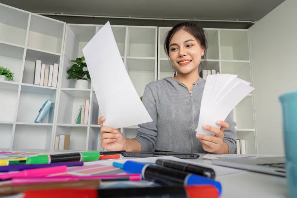 istock Young Graphic Designer Working with Colorful Markers and Papers in Modern Office Space 2167850391