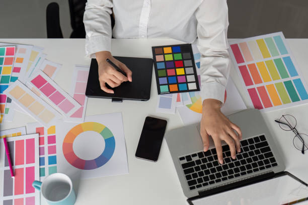 istock Creative Graphic Designer Working with Color Palettes and Digital Tools in Modern Office Environment 2167850706
