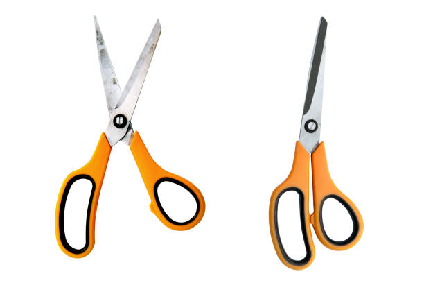 Yellow scissors isolated on a white background