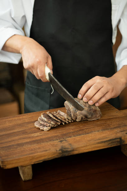 istock The chef is cutting meat on a cutting board. 2167851156