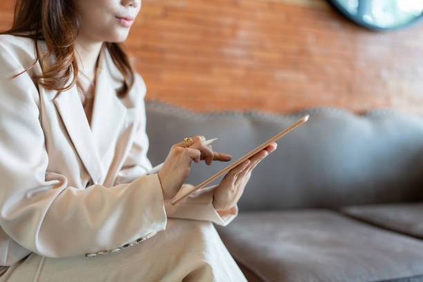 istock Working from her office, the female executive utilized her laptop to craft business presentations and reports, ensuring her team was always informed and prepared for any challenges. 2167856389