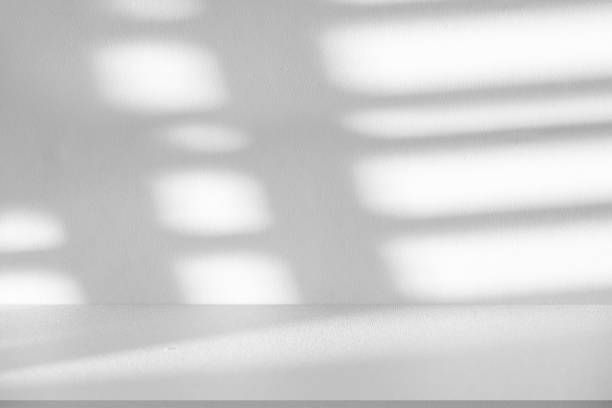 istock Studio style background wall decoration presentation uses white tones. with shadows cast from a nearby window, concept creating a decorative backdrop. 2167857103