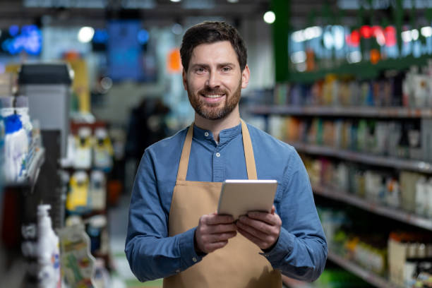 istock Smiling supermarket worker using digital tablet for inventory management 2167857453