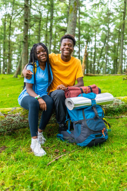 istock African friends embracing sitting in the forest 2167863305