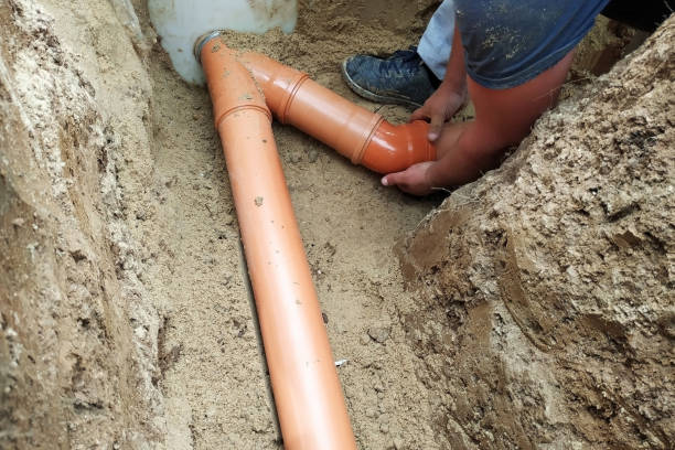 istock A locksmith supplies a sewer pipe to the sump. 2167869362