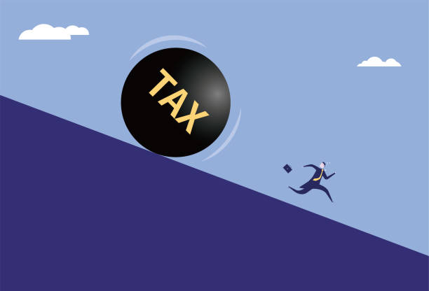 istock Tax iron ball rolling towards running business man 2167871517