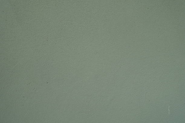 istock Background - reseda green wall with coarse roughcast finish 2167871665