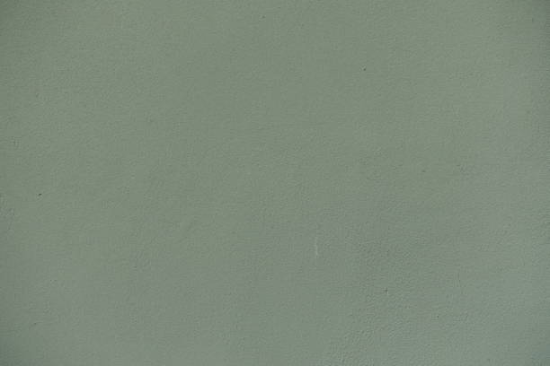 istock Front view of reseda green wall with coarse roughcast finish 2167871685