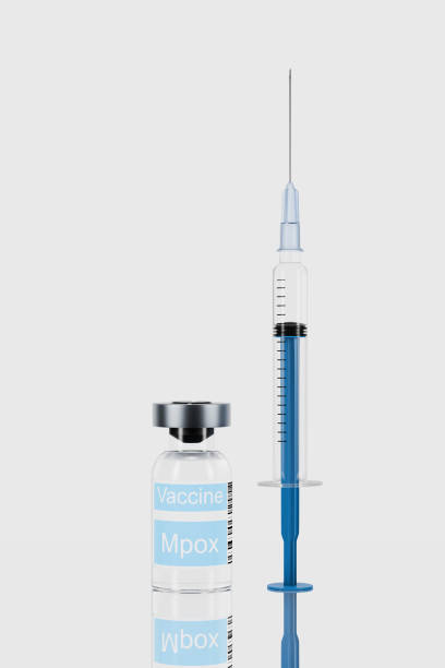 istock Vial labeled Vaccine Monkeypox next to a syringe on a reflective surface, representing a medical solution for preventing the Mpox virus and boosting public health immunity. 2167872084
