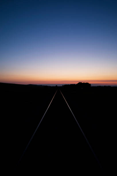 istock Single-track railway line at sunset, Austria. 2167874679