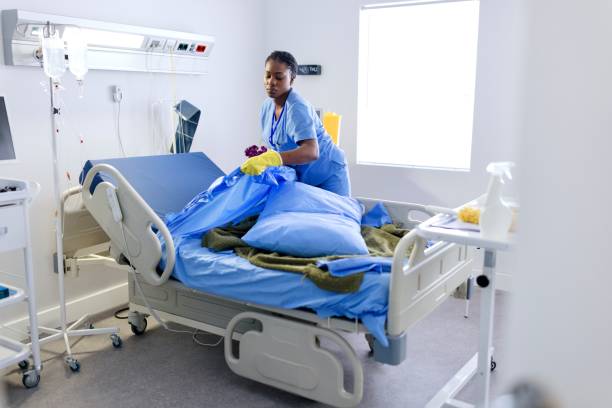 istock Woman changing bed sheets at the hospital 2167874862