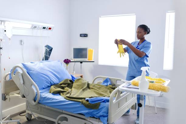 istock Cleaning lady preparing a room for the next patient 2167874863
