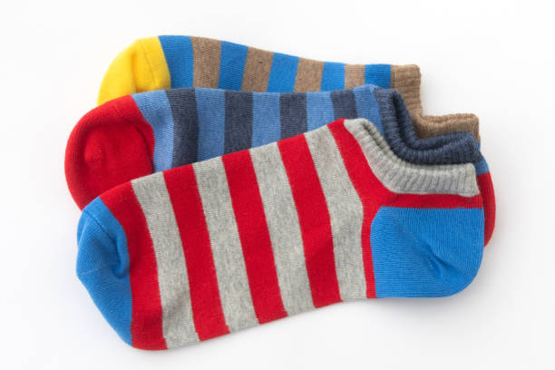 istock Three Colorful Striped Socks on White Background, Top View 2167876184