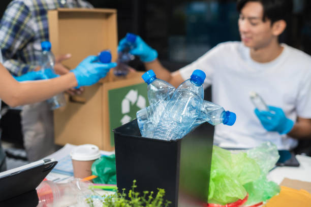 istock Business people working examining waste recyclable separation divided bin in the office, Sustainable development and innovation green business concept. 2167877553