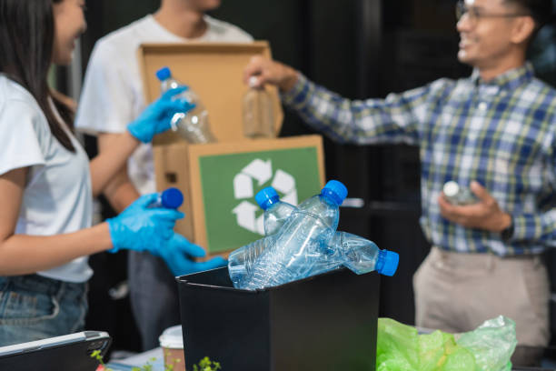 istock Business people working examining waste recyclable separation divided bin in the office, Sustainable development and innovation green business concept. 2167877567