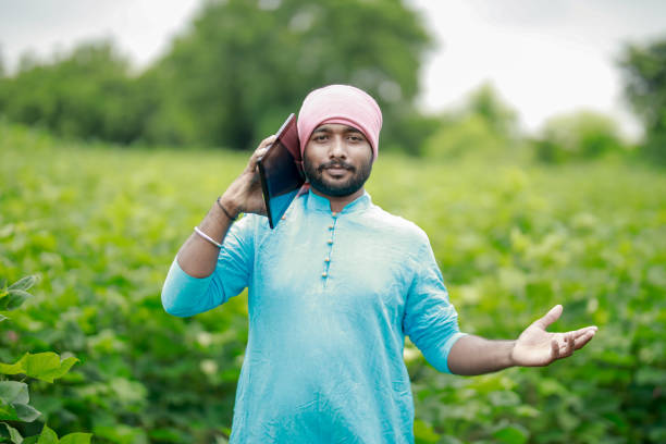 istock happy young Indian farmer using smart phone 2167881665