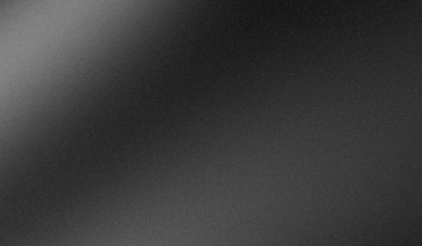 istock Blurry gradient grainy dark gray metallic monochrome background banner 2167882034
