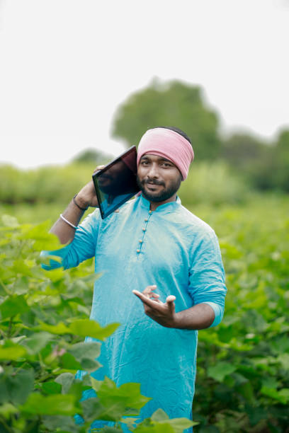 istock happy young Indian farmer using smart phone 2167882103