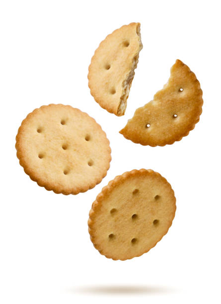 istock Crackers and halves flying on white background. Isolated 2167882118