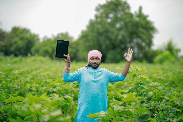 istock happy young Indian farmer using smart phone 2167882226