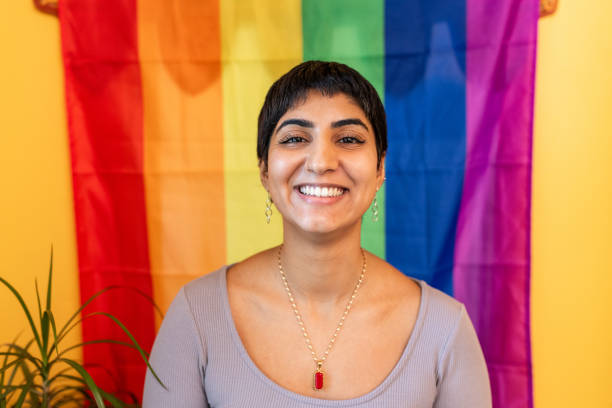 istock Surrogate mother smiling with rainbow flag background 2167882309