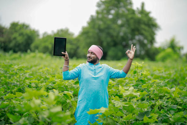 istock happy young Indian farmer using smart phone 2167882522